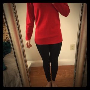 Red long sleeve sweater, long in the back